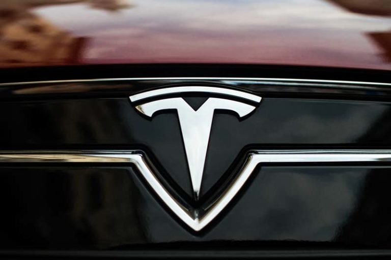 Close-up-of-TESLA-trademark-sign-on-a-car