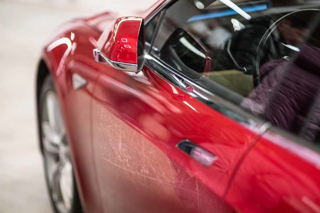 Red-Tesla-With-Scratch-Marks