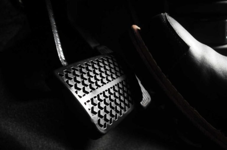 accelerator-and-breaking-pedal-in-a-car-close-up-the-foot-pressing-foot-pedal-of-a-car-to-drive-ahead