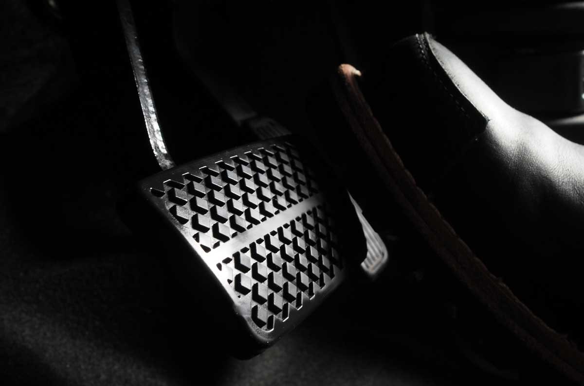 accelerator-and-breaking-pedal-in-a-car-close-up-the-foot-pressing-foot-pedal-of-a-car-to-drive-ahead