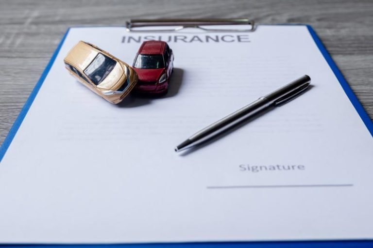 car-and-pen-on-insurance-documents-car-insurance